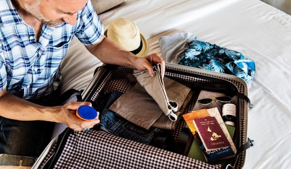 man packing a bag