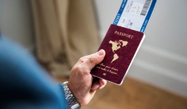 A man holding a passport